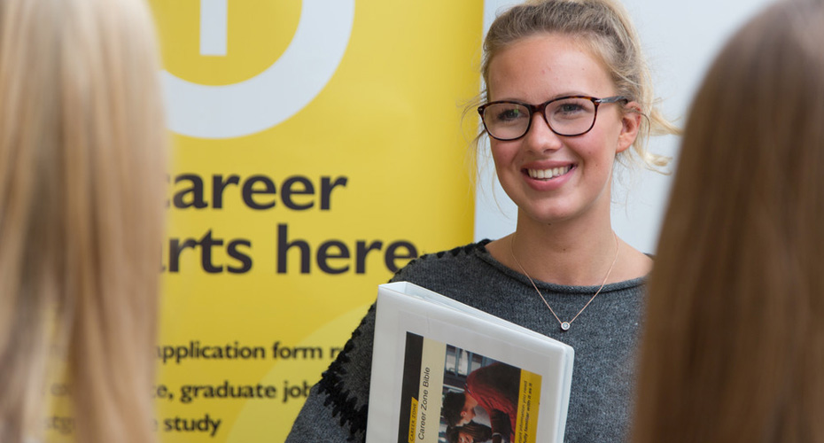 Student holding a Career Zone Bible